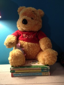Winnie the Pooh (and Piglet) and the books my sister used to read us. Photo by Suzanne Vince